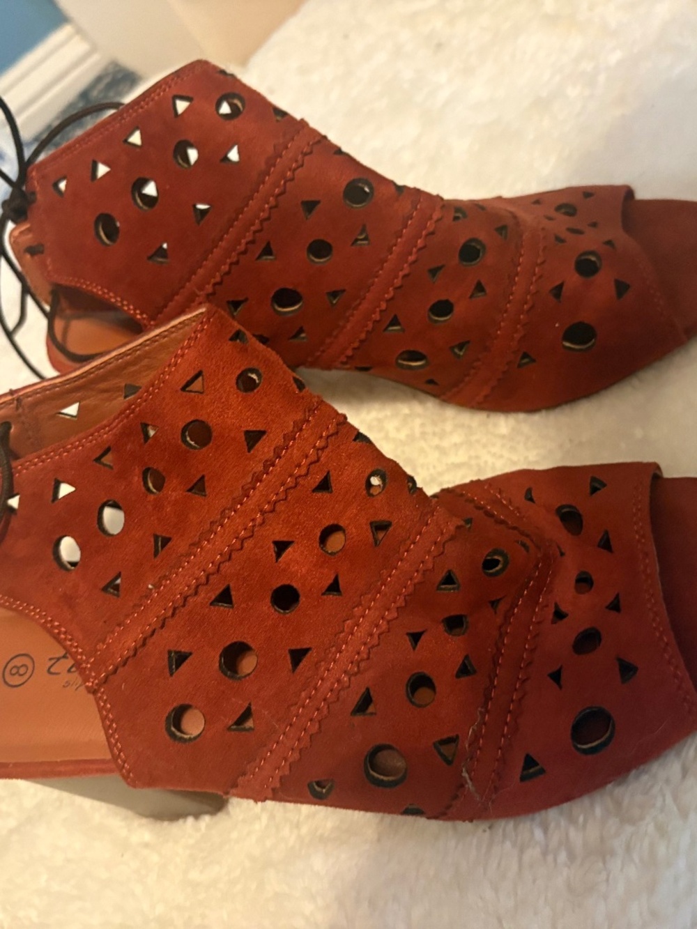 Twisted ankle boots